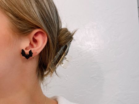 Black glitter spooky bat studs on Sale